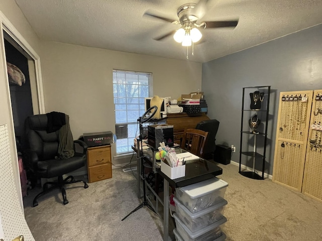 office space with ceiling fan, carpet, and a textured ceiling