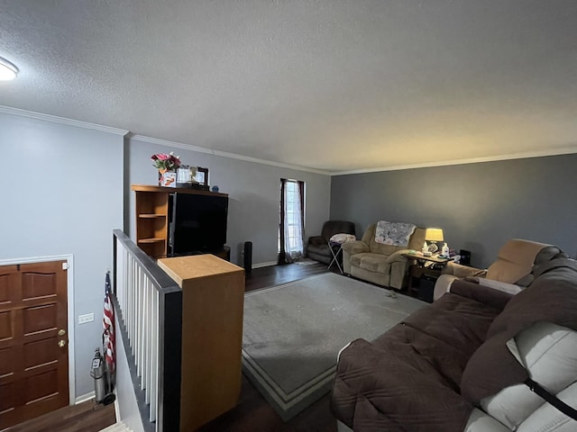 living room with ornamental molding, dark hardwood / wood-style flooring, and a textured ceiling