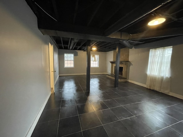 basement with dark tile patterned flooring