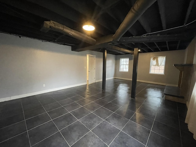 basement with dark tile patterned floors