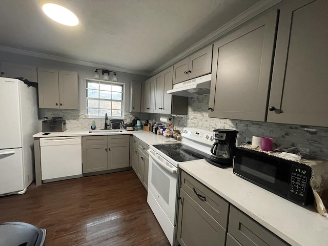 kitchen with sink, white appliances, gray cabinets, and ornamental molding