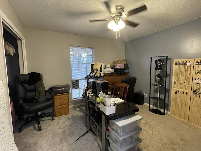 office space with a healthy amount of sunlight, carpet floors, and a textured ceiling