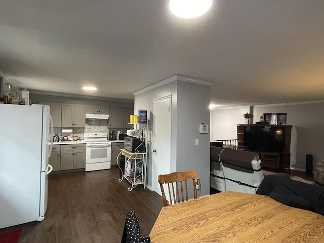 kitchen featuring white appliances, ornamental molding, dark hardwood / wood-style flooring, and gray cabinets