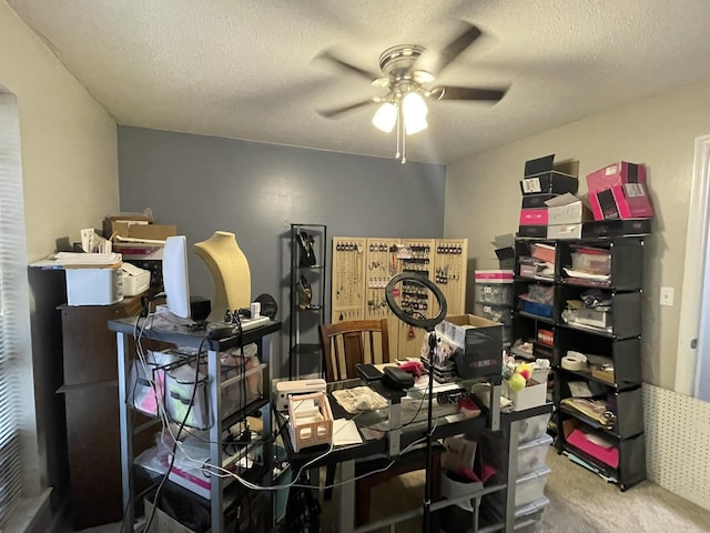 office with ceiling fan, carpet floors, and a textured ceiling