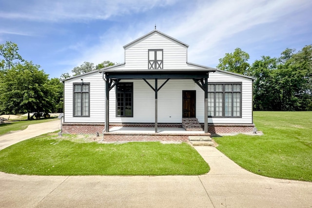 - view of front of house with a front lawn and covered porch