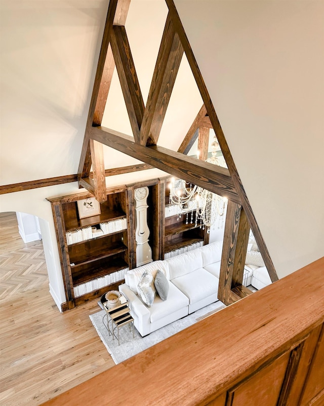  - living room with light wood finished floors and a chandelier