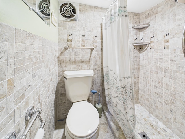  - full bath with tile walls and a shower stall