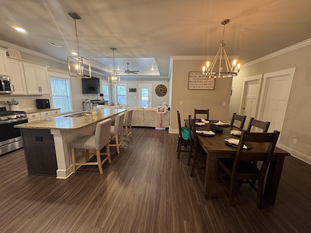 dining space featuring baseboards, dark wood-type flooring, and a notable chandelier