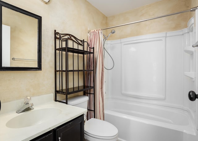 bathroom with a textured wall, shower / bath combo, vanity, and toilet