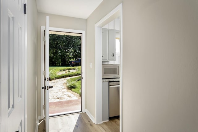 entryway with light hardwood / wood-style flooring