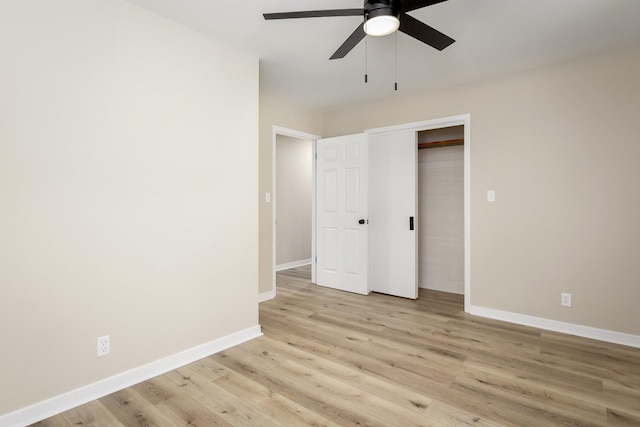 unfurnished bedroom featuring light wood-type flooring, a closet, and ceiling fan