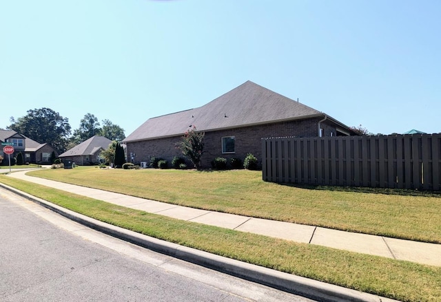  - view of home's exterior featuring brick siding