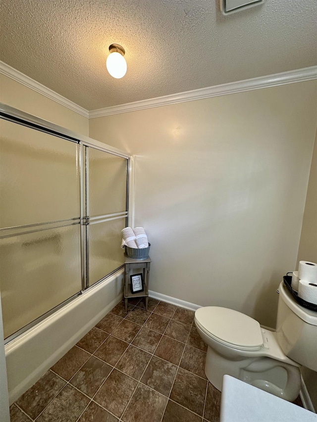 bathroom with crown molding, toilet, a textured ceiling, tile patterned floors, and enclosed tub / shower combo