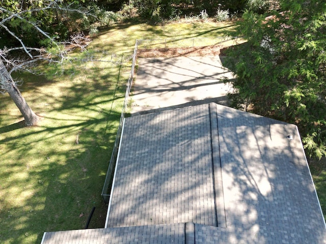 exterior space with a shingled roof