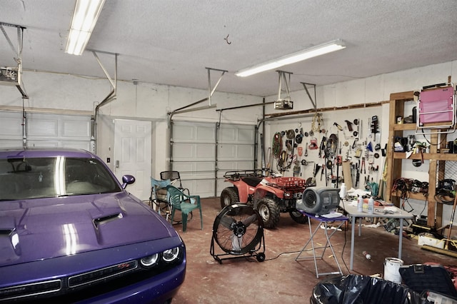 garage featuring a workshop area and a garage door opener