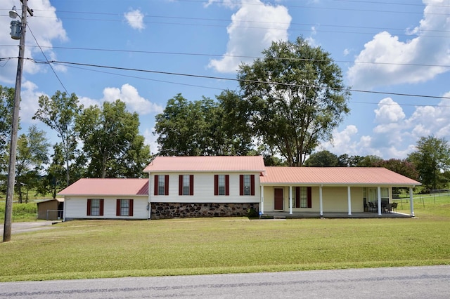 view of front of property with a front yard and a porch