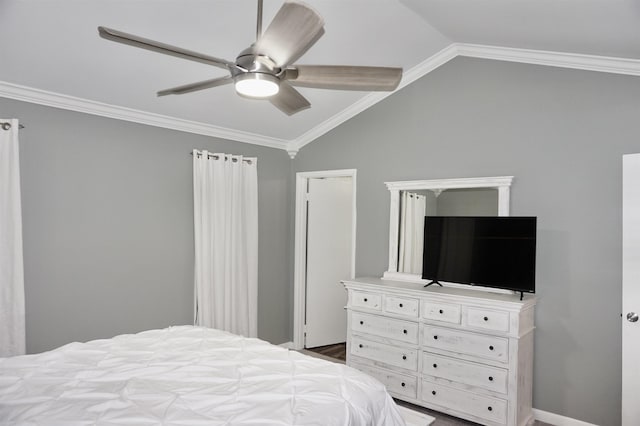 bedroom featuring ceiling fan, vaulted ceiling, and ornamental molding