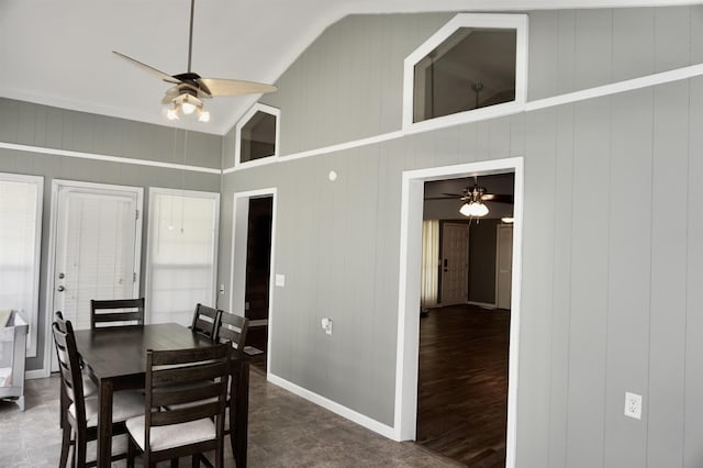 dining space featuring ceiling fan and lofted ceiling