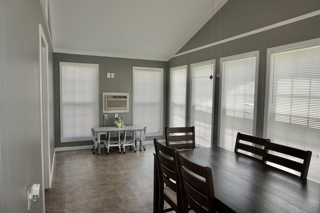 dining area with a wall mounted air conditioner, lofted ceiling, and ornamental molding