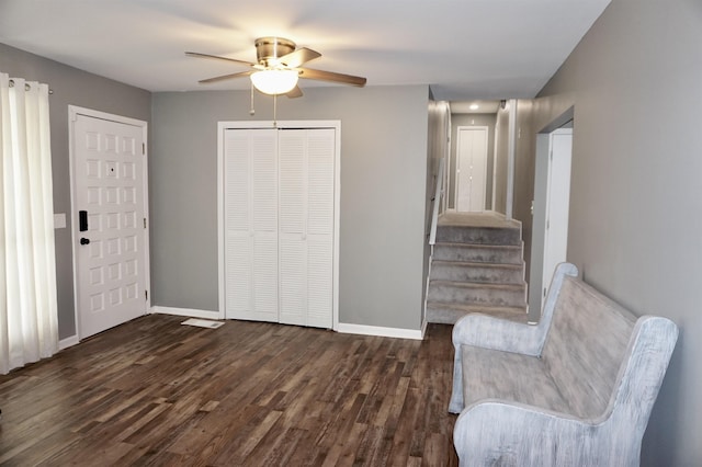 unfurnished room with dark hardwood / wood-style flooring and ceiling fan