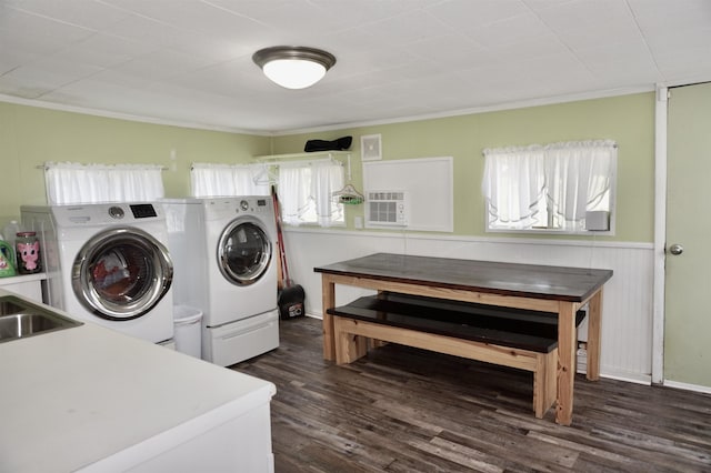 washroom with crown molding, washer and clothes dryer, dark hardwood / wood-style floors, and sink