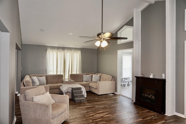 living room featuring vaulted ceiling with beams, ceiling fan, and dark wood-type flooring