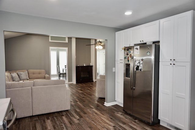 kitchen featuring ceiling fan, stainless steel fridge, dark hardwood / wood-style flooring, and white cabinetry