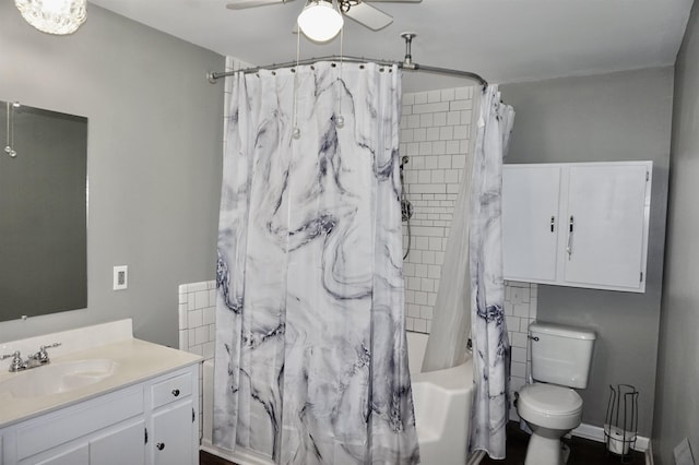 full bathroom featuring shower / bath combo, vanity, toilet, and ceiling fan