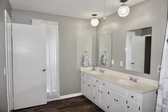 bathroom with hardwood / wood-style floors and vanity