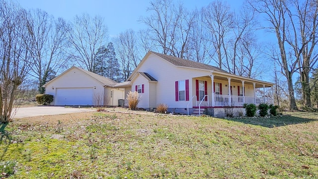 view of front facade featuring concrete driveway, a front yard, covered porch, crawl space, and an attached garage