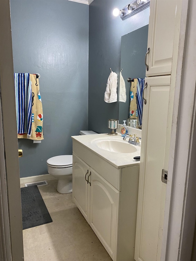  - bathroom featuring vanity and toilet