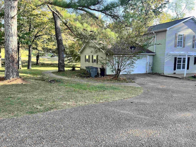  - view of front of home featuring a garage