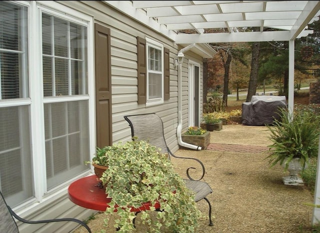  - view of patio / terrace featuring a pergola