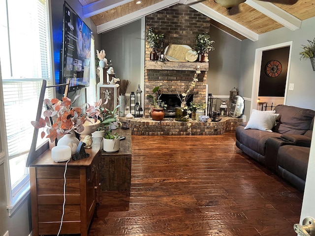  - living room with a fireplace, hardwood / wood-style floors, and lofted ceiling with beams