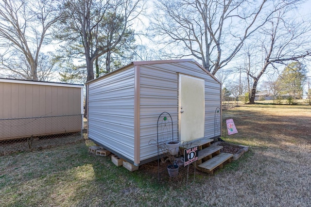 view of shed with fence