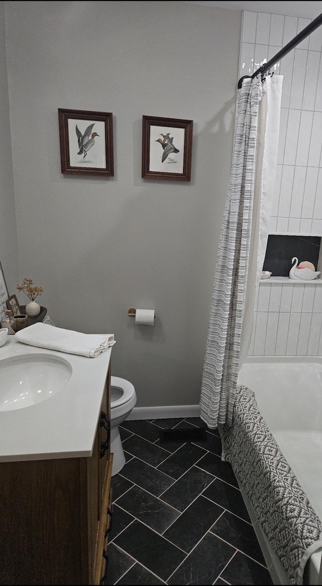  - full bath featuring vanity, tiled shower / bath combo, and tile patterned flooring
