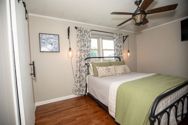  - bedroom with wood finished floors, crown molding, and ceiling fan