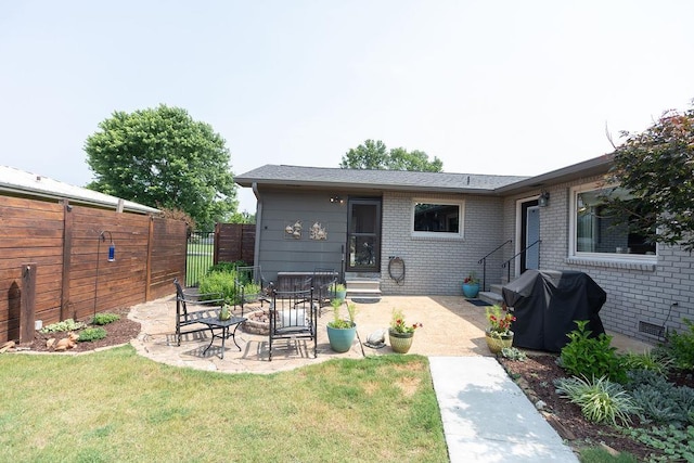  - rear view of property with entry steps, brick siding, and a patio area