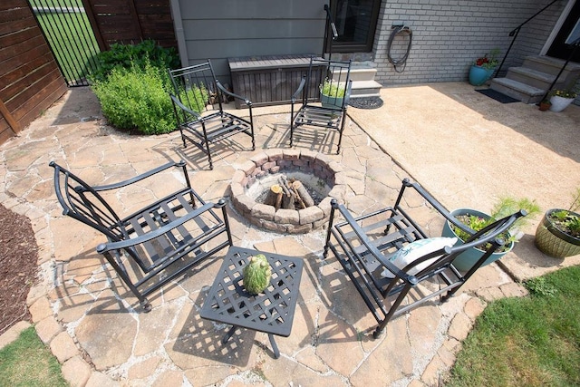  - view of patio / terrace featuring a fire pit and entry steps