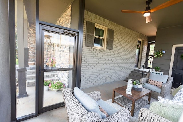  - porch with a ceiling fan and an outdoor hangout area