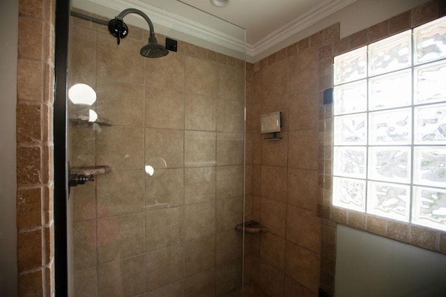  - bathroom with crown molding and tiled shower