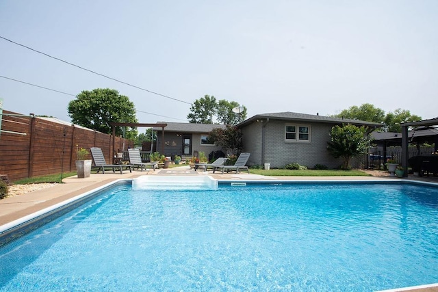  - view of pool featuring a fenced backyard and a patio area