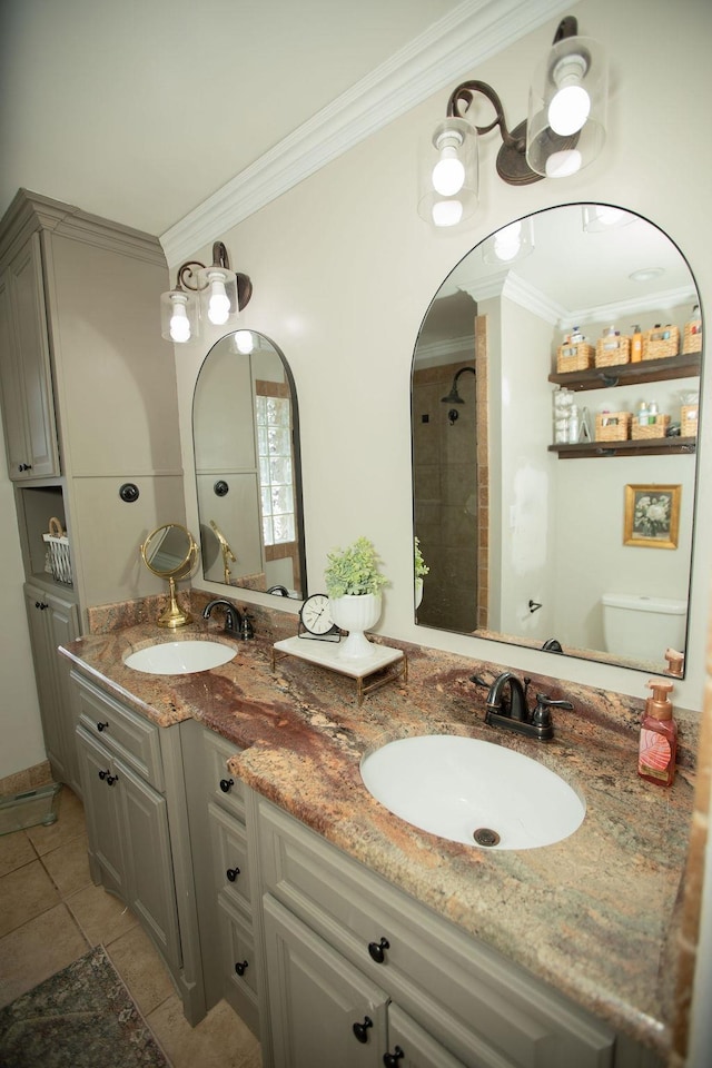  - bathroom featuring ornamental molding, double vanity, and tile patterned floors