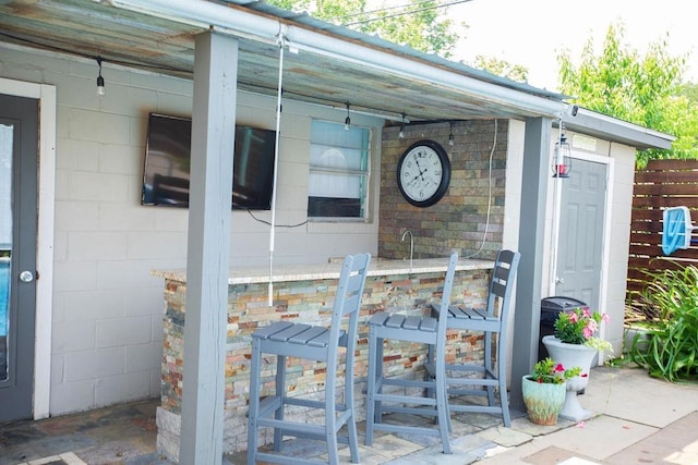 - view of exterior entry featuring concrete block siding