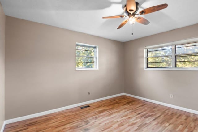 empty room featuring ceiling fan and light wood-type flooring