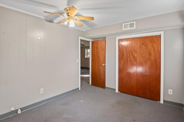 unfurnished bedroom with carpet flooring and ceiling fan