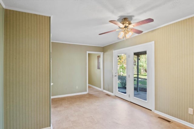 unfurnished room featuring ceiling fan and crown molding