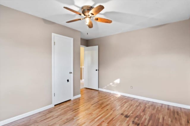 spare room with ceiling fan and light hardwood / wood-style flooring