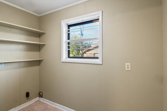 laundry area featuring ornamental molding