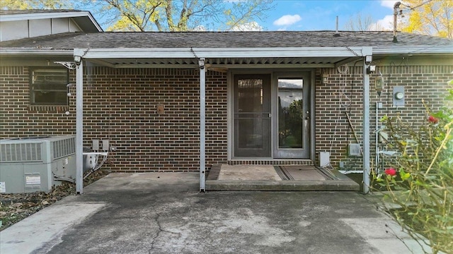 view of exterior entry featuring cooling unit